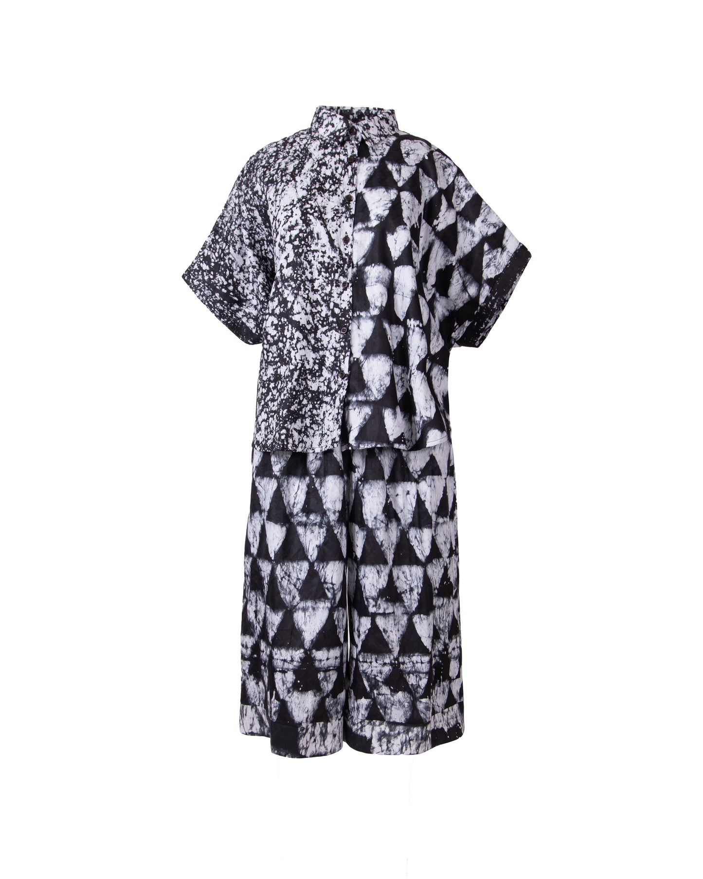 Black and white patterned shirt and elastic waist pants on a white background