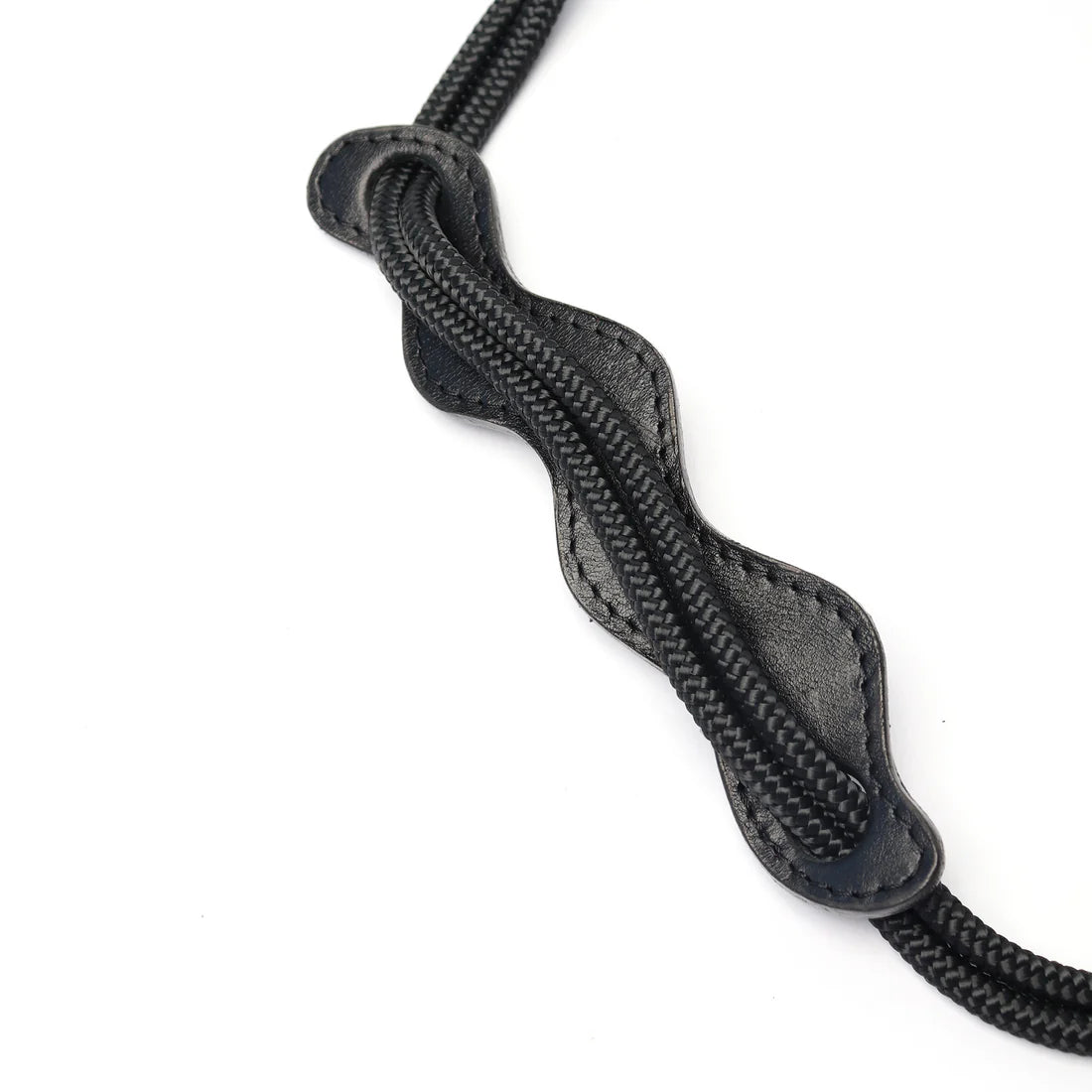 Close-up of a black braided leather strap on a white background