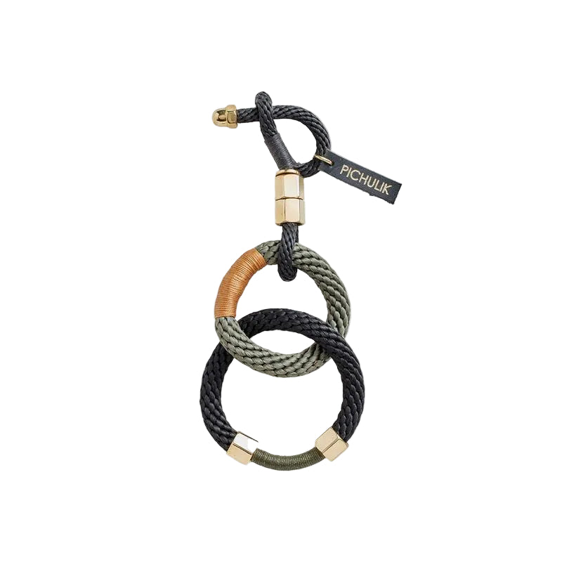 Bracelet with interlocking loops in black, brown, and green on a white background