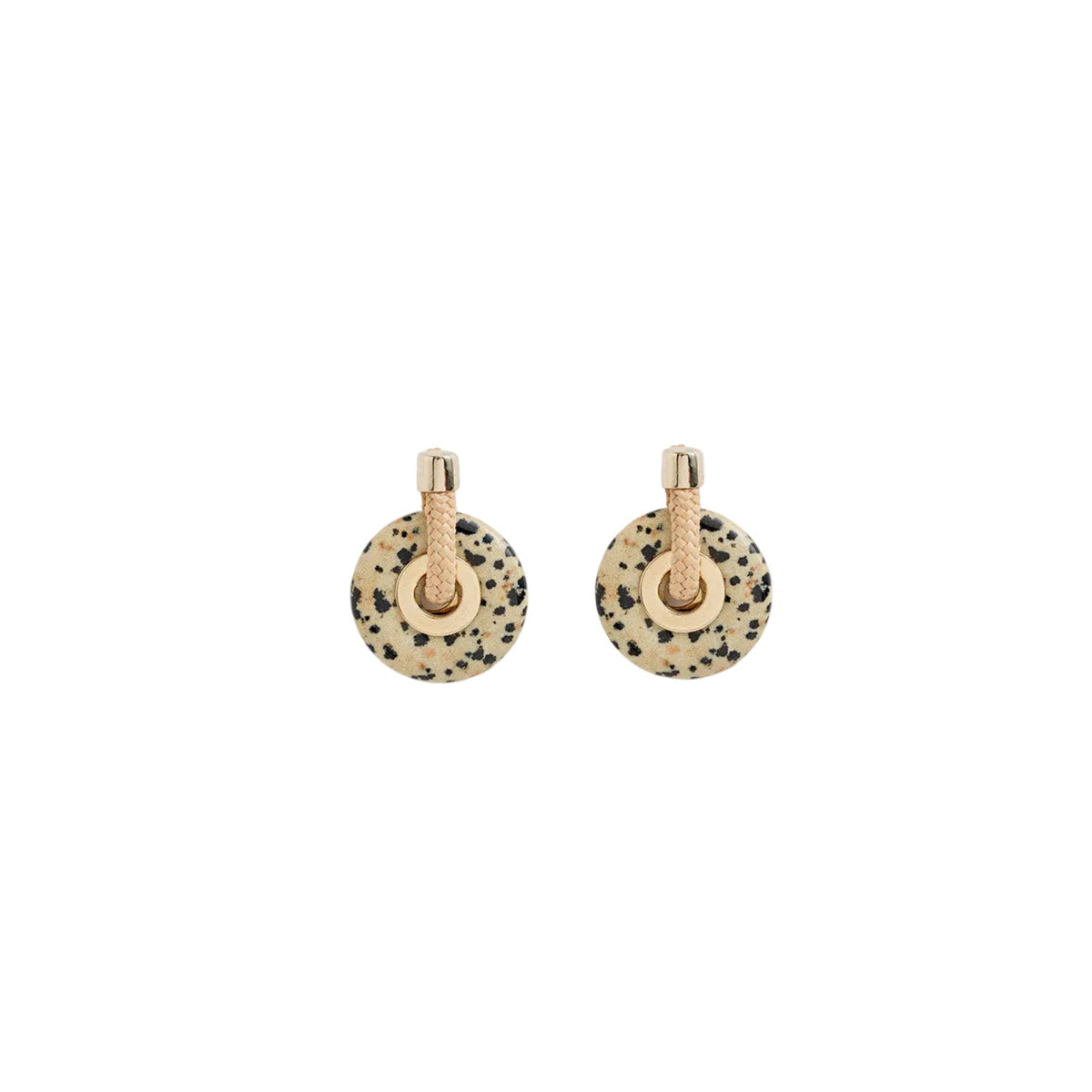A pair of gold-toned stud earrings featuring circular beige and black speckled stone discs with a textured gold post, shown on a plain white background.