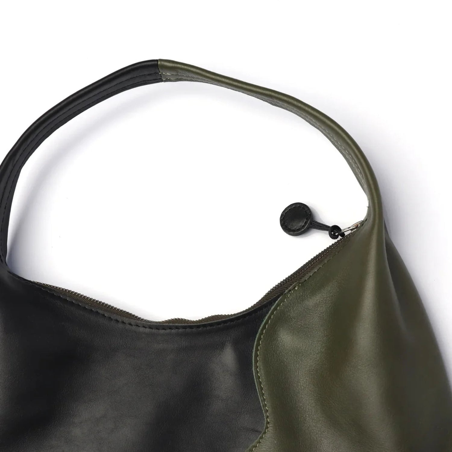Close up mage of the Libra Moss Black handle and two tone zip.