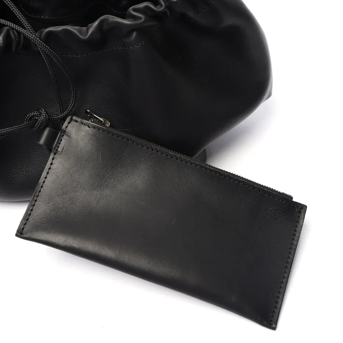 Black leather pouch with a drawstring on a white background