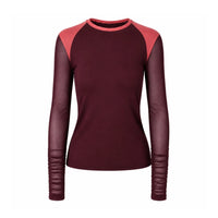 A women's long-sleeve mesh top with a deep burgundy body, contrasting coral pink shoulder yokes, and matching burgundy sleeves with gathered ribbed cuffs.