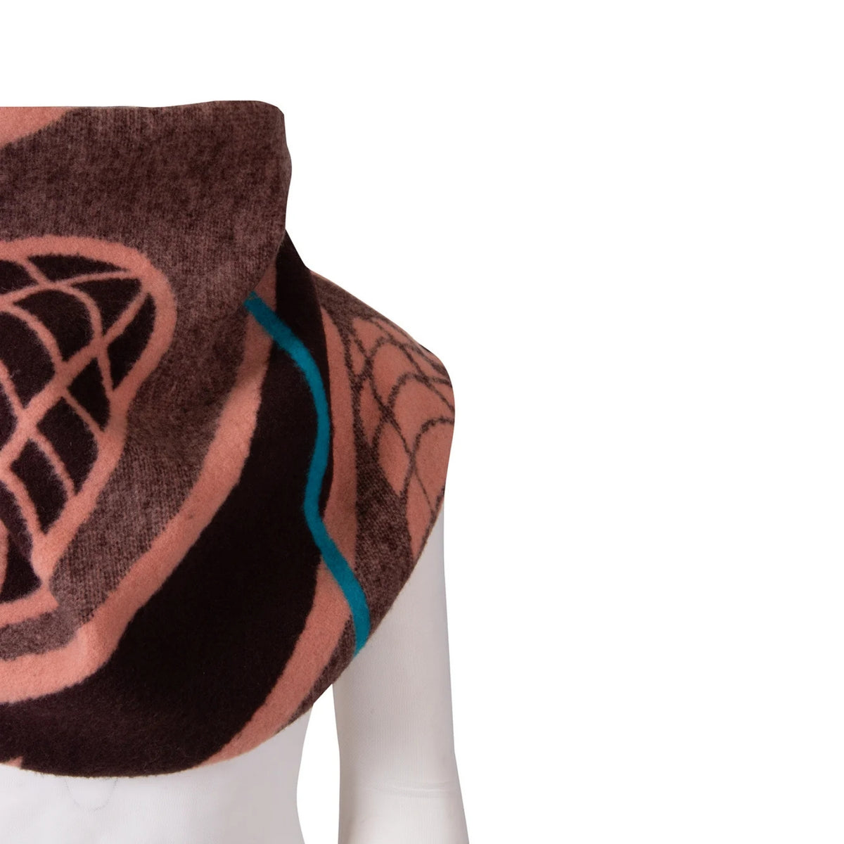 A close-up of a patterned scarf draped on a white mannequin torso against a plain white background. The scarf features a dark brown base with dusty pink geometric and web-like patterns, and a thin bright teal accent line.