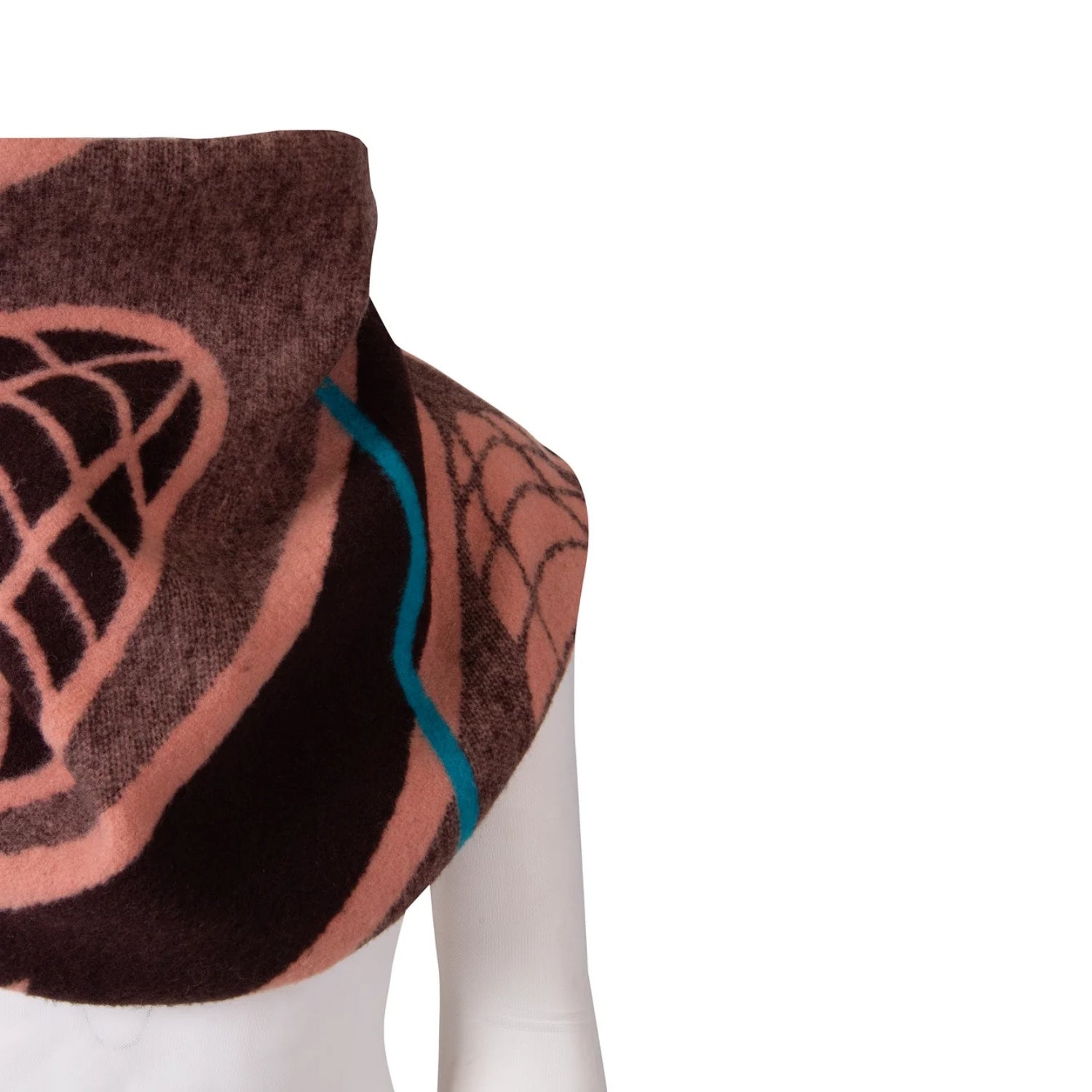 A close-up of a patterned scarf draped on a white mannequin torso against a plain white background. The scarf features a dark brown base with dusty pink geometric and web-like patterns, and a thin bright teal accent line.