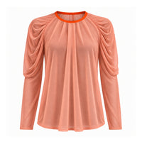 A peach-colored long-sleeve blouse with gathered puff sleeves and a contrasting bright orange crew neck trim, shown against a plain white background.