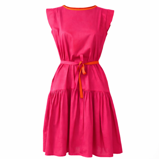 Guillotine Hot Pink Frill Dress featuring contrast orange neckline trim and two-tone waist tie, shown from the front to highlight the sculptural silhouette, gathered waist detail and flowing frill hem.
