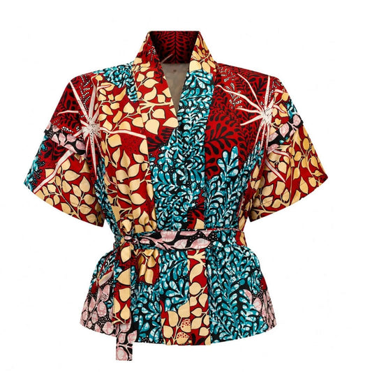 A short-sleeved wrap-style robe with a self-tie belt, featuring a bold, multicolor African wax print pattern with red, teal, beige, and black floral and geometric motifs.