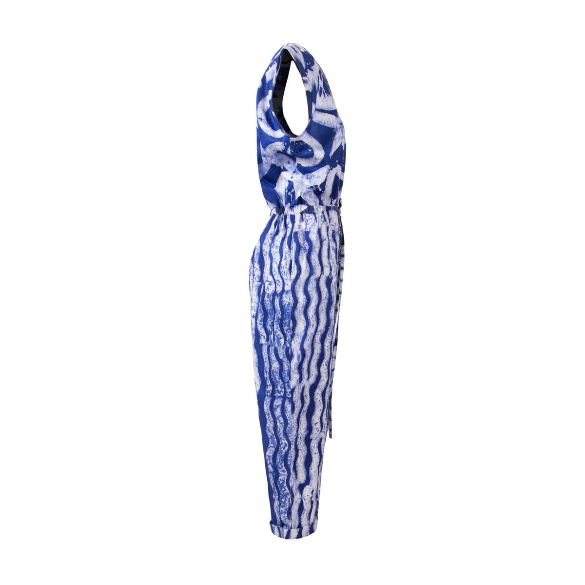A sleeveless halter-neck jumpsuit featuring a blue and white wavy, tie-dye-like pattern, shown from the side against a plain white background.
