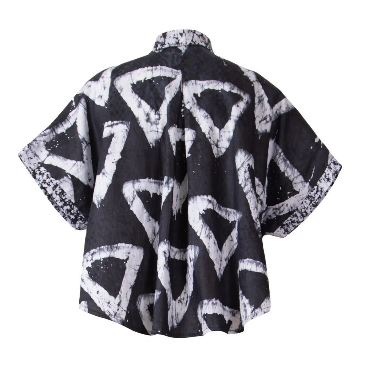 A short-sleeve button-up shirt shown from the back, featuring a black base with a bold white abstract geometric pattern.