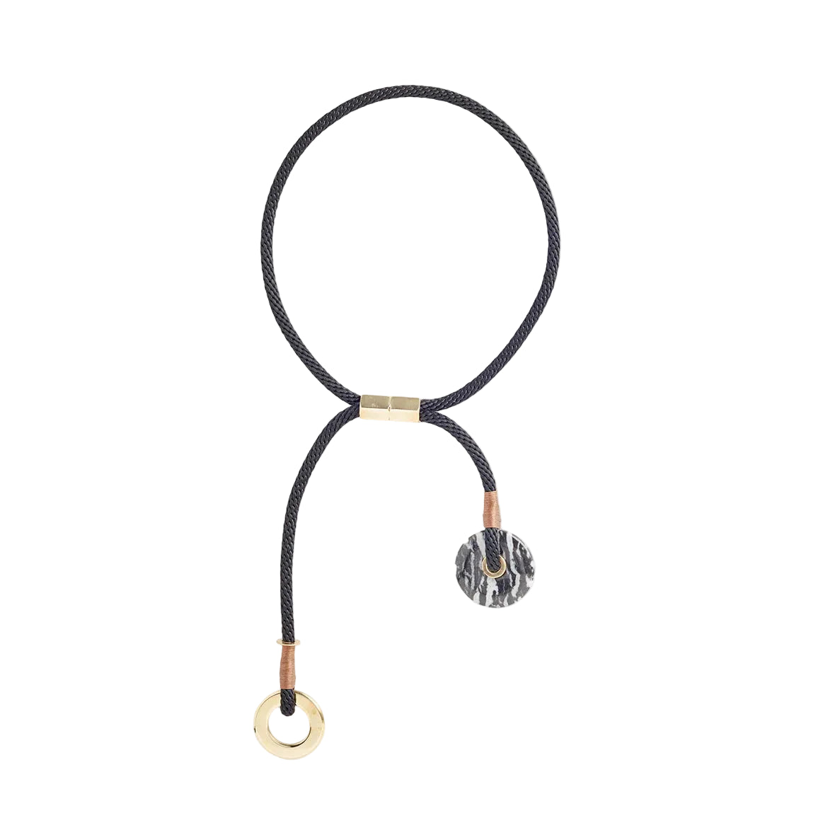 A black braided cord necklace with gold-toned hardware, featuring a circular ring at one end and a textured round charm at the other, displayed on a solid white background.