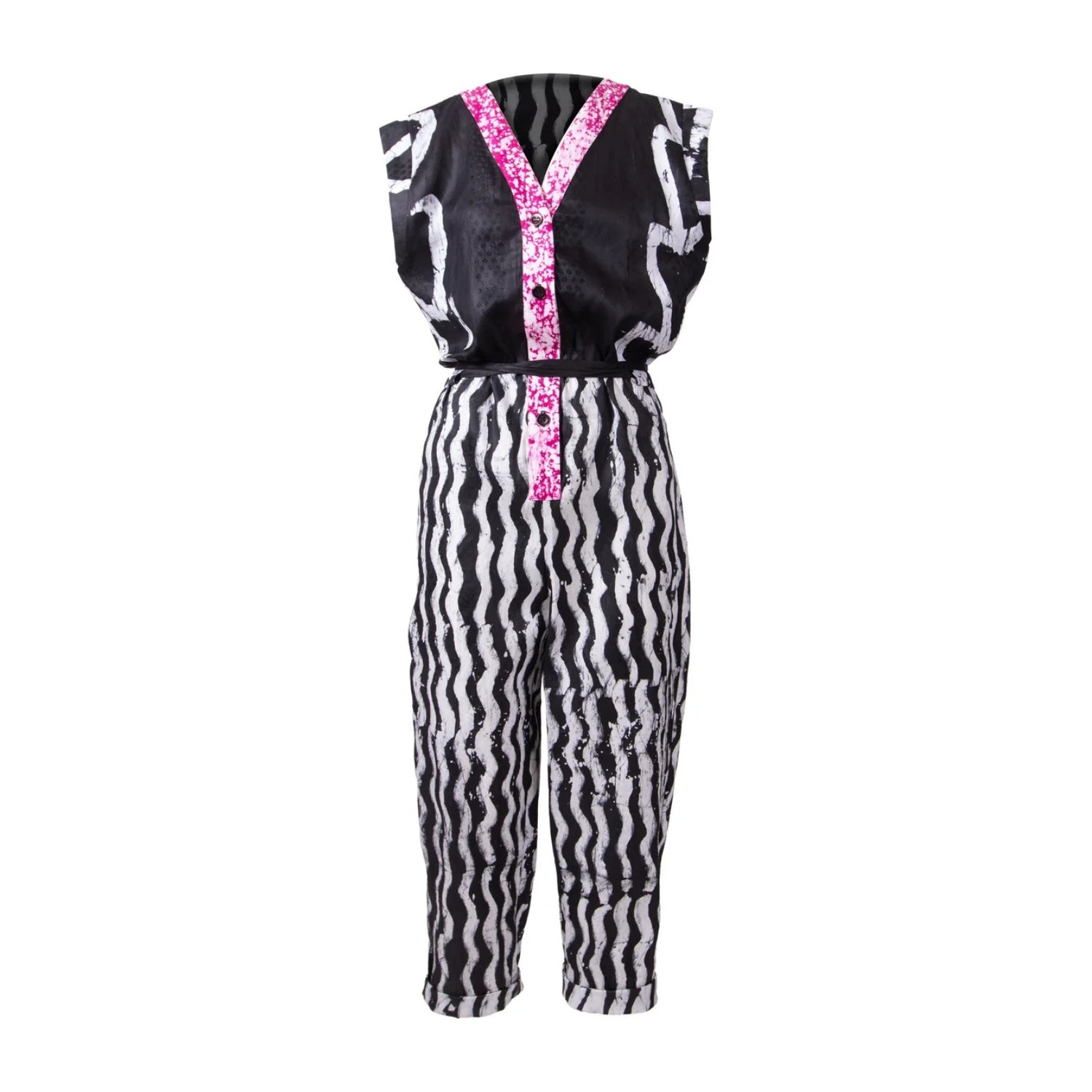 A sleeveless one-piece costume jumpsuit featuring a black and white wavy zebra print, with a bright pink patterned V-neckline and button detail on a white background.