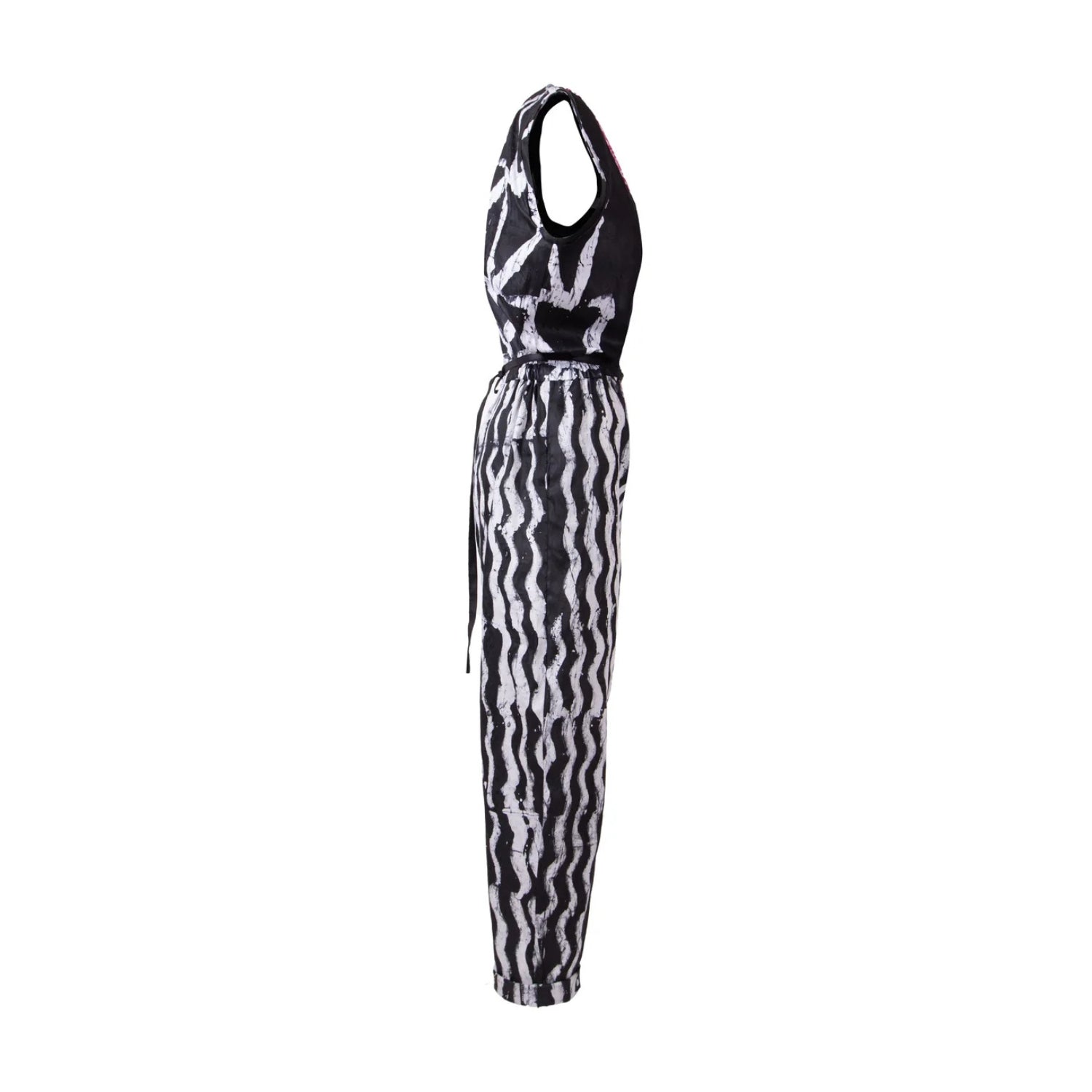 A sleeveless halter-neck jumpsuit with a black and white wavy abstract pattern, shown from the back against a plain white background.