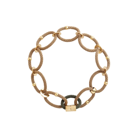 A beige olive-colored necklace with gold-tone brass accents and rope combinations, featuring brass end clasps.
