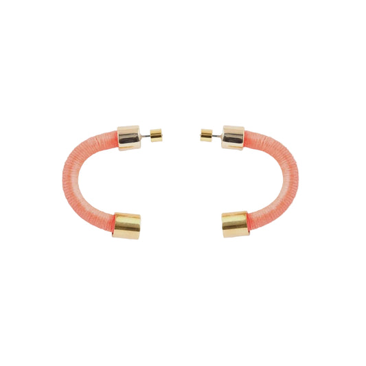 A pair of open-ended hoop earrings with textured coral pink resin bodies and polished gold-tone metal caps, displayed on a clean white background.