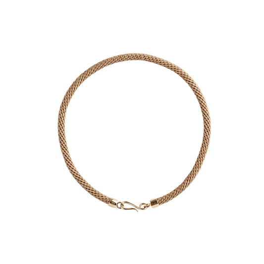 Woven beige necklace with gold clasps on a light background