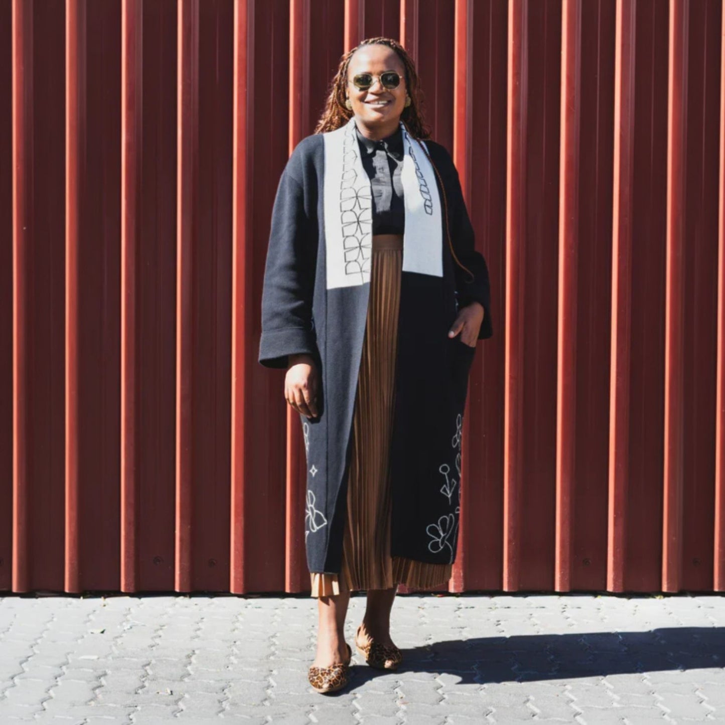 Romaria Rooted Coat in black knit with floral embroidery with pockets
