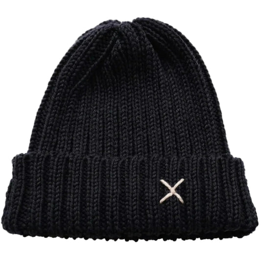 A black ribbed knit beanie hat featuring a small white embroidered 'X' logo on the front cuff.