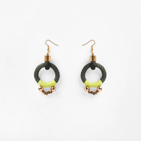 Circular olive and yellow rope earrings featuring a sleek s-hook clasp for secure fastening. The striking colors of olive and yellow intertwine beautifully, creating a striking visual contrast. Delicate beads embellish the bottom of the earrings, accented with shimmering gold beads that add a touch of elegance. The circular design offers a modern and versatile aesthetic, suitable for various occasions.