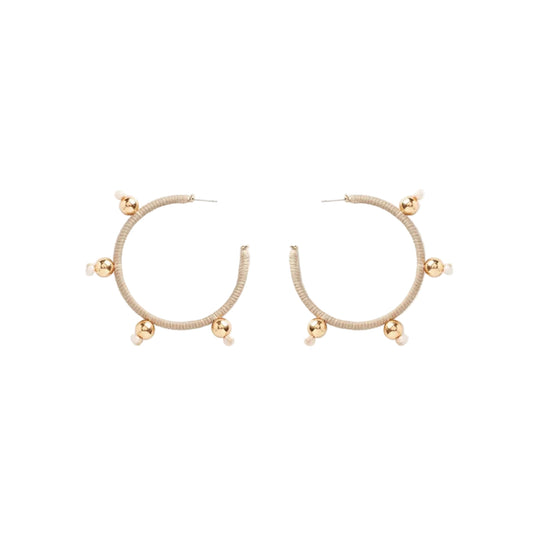 A pair of gold hoop earrings with a textured beige band and small gold bead accents at the outer edges, displayed on a clean white background.