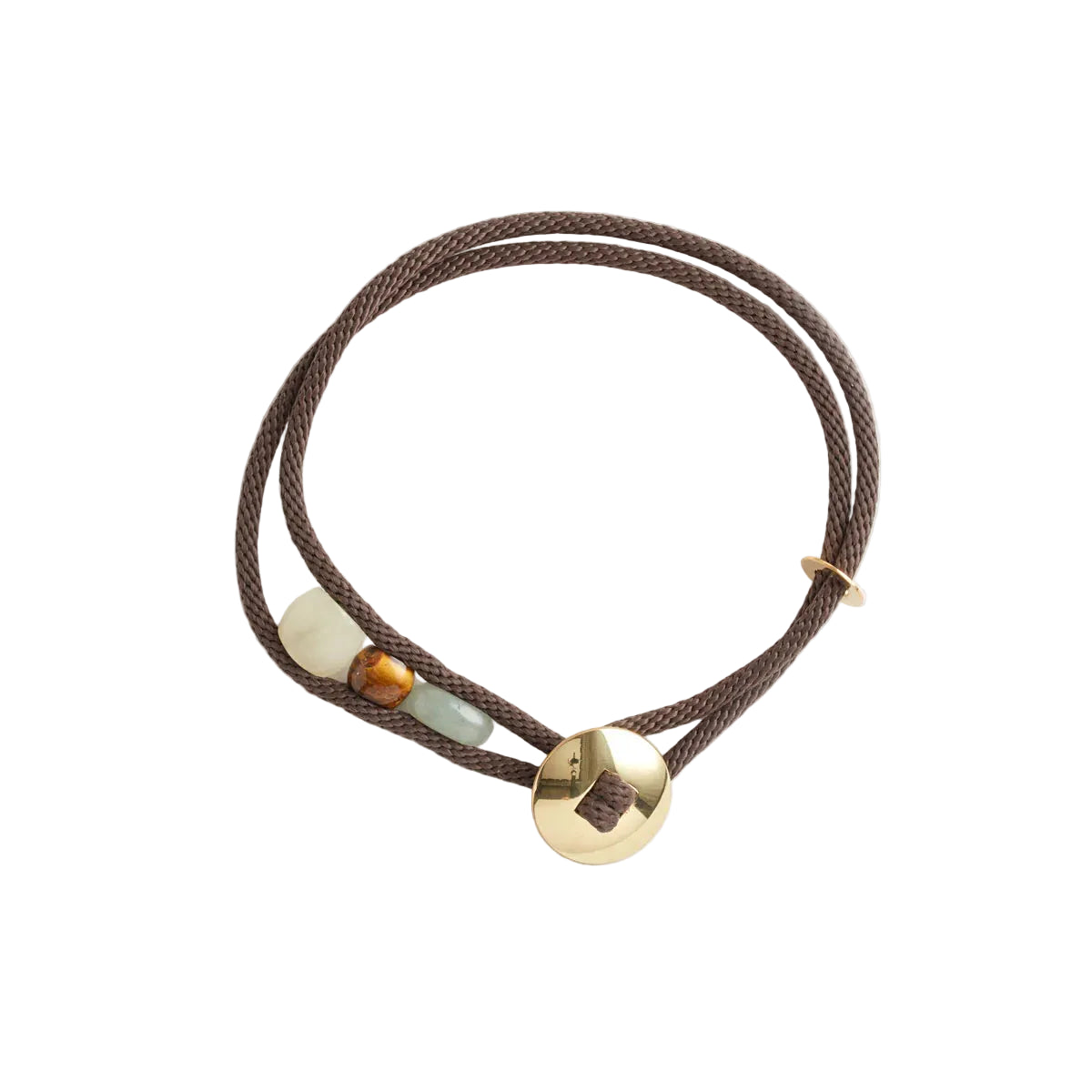 Brown cord bracelet with gold and gemstones on a white background