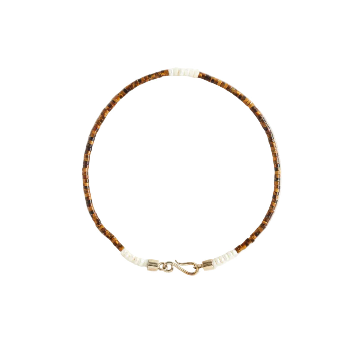 Necklace with brown and pearl beads on a light gray background