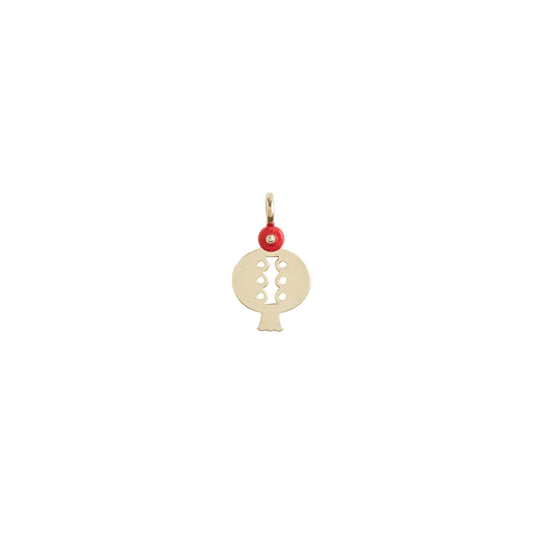 Gold pendant with a red accent on a white background
