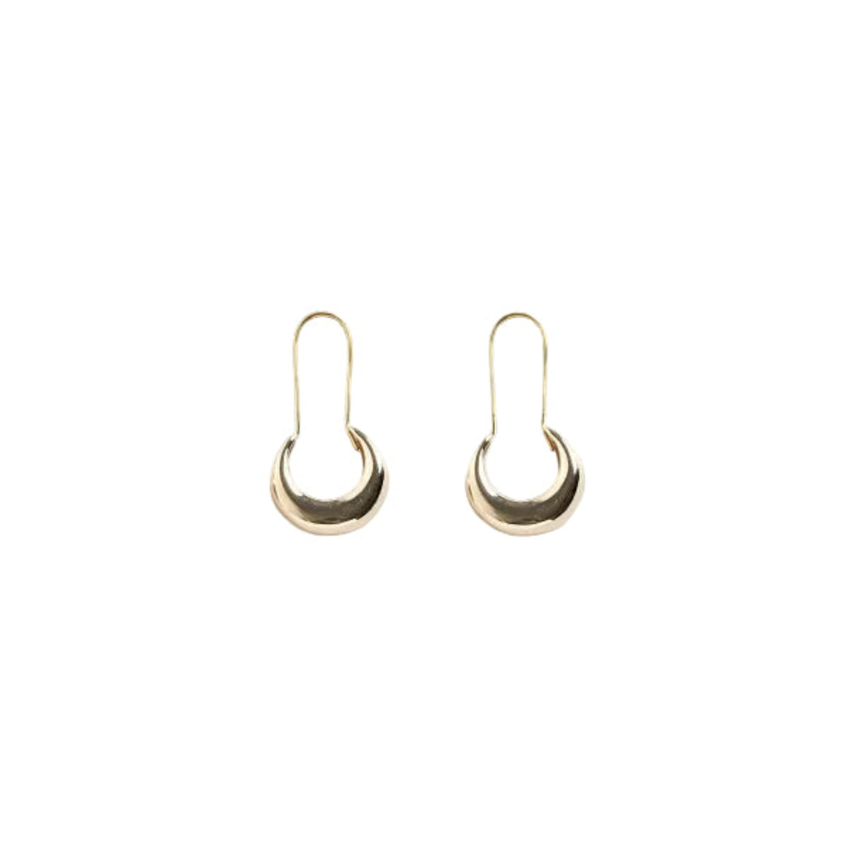 Crescent moon  shaped gold hoop earrings made from solid jeweler's brass.