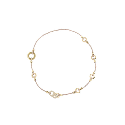 A delicate gold chain bracelet with small gold ring connectors and a heart-shaped clasp, displayed on a clean white background.
