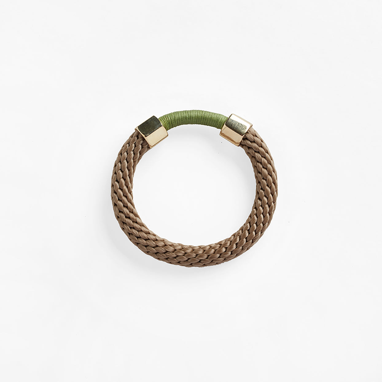 The Aruba Bracelet is a chunkier statement bracelet that features two metal embellishments. The rope texture and contrasting colours in the bracelet offers a unique look.