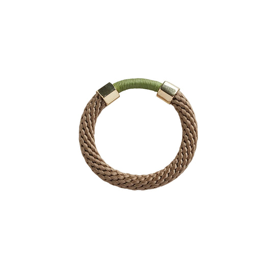 The Aruba Bracelet is a chunkier statement bracelet that features two metal embellishments. The rope texture and contrasting colours in the bracelet offers a unique look.