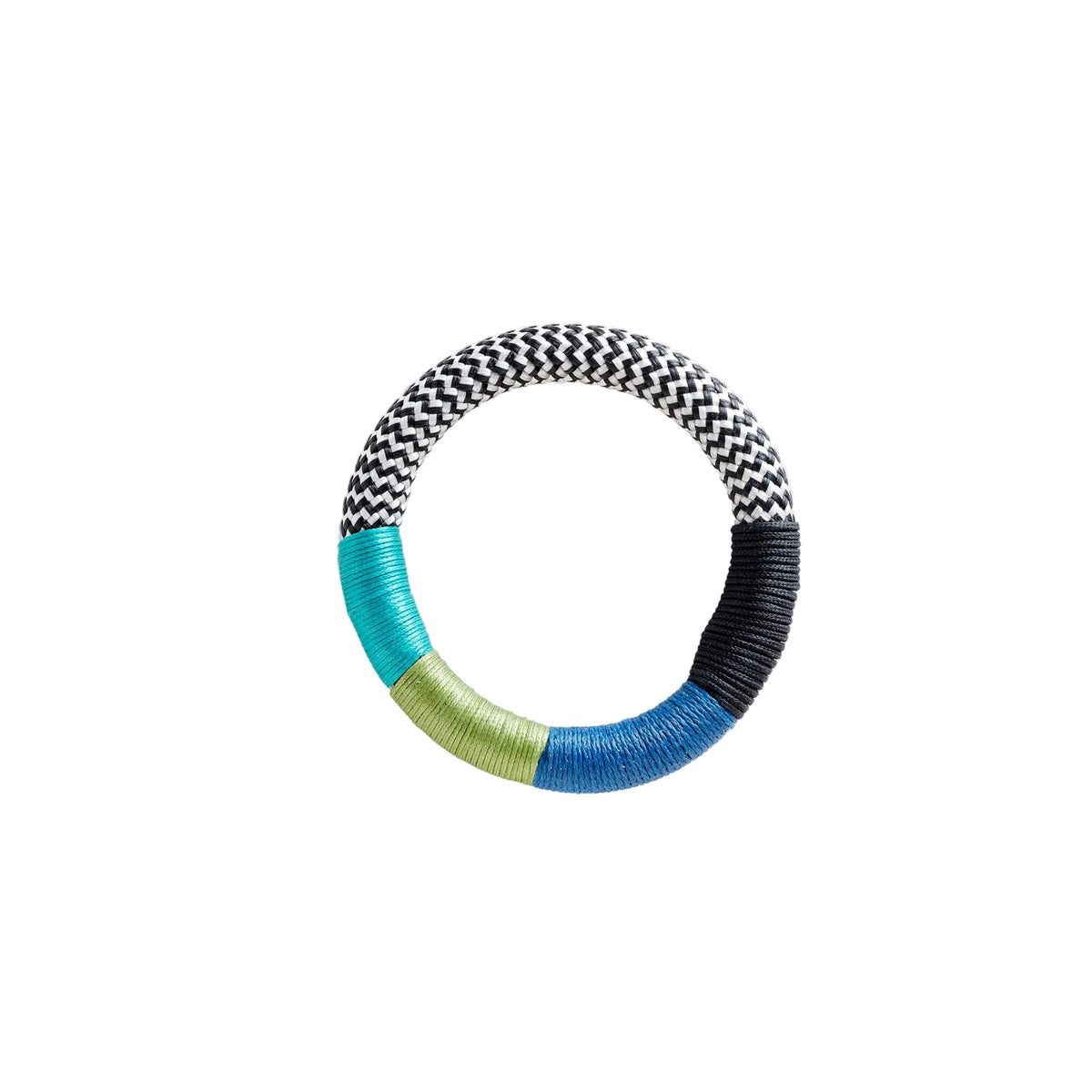 A circular woven rope ring with a black and white chevron pattern, a turquoise blue section, a light olive green section, and a dark blue section, isolated on a white background.