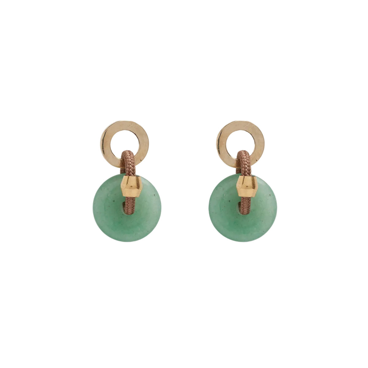 A person wearing a beige coat and green aventurine stone earrings with brass and silver studs.