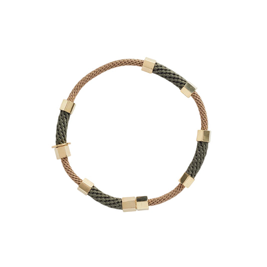 A beige and olive colored choker necklace with brass details.